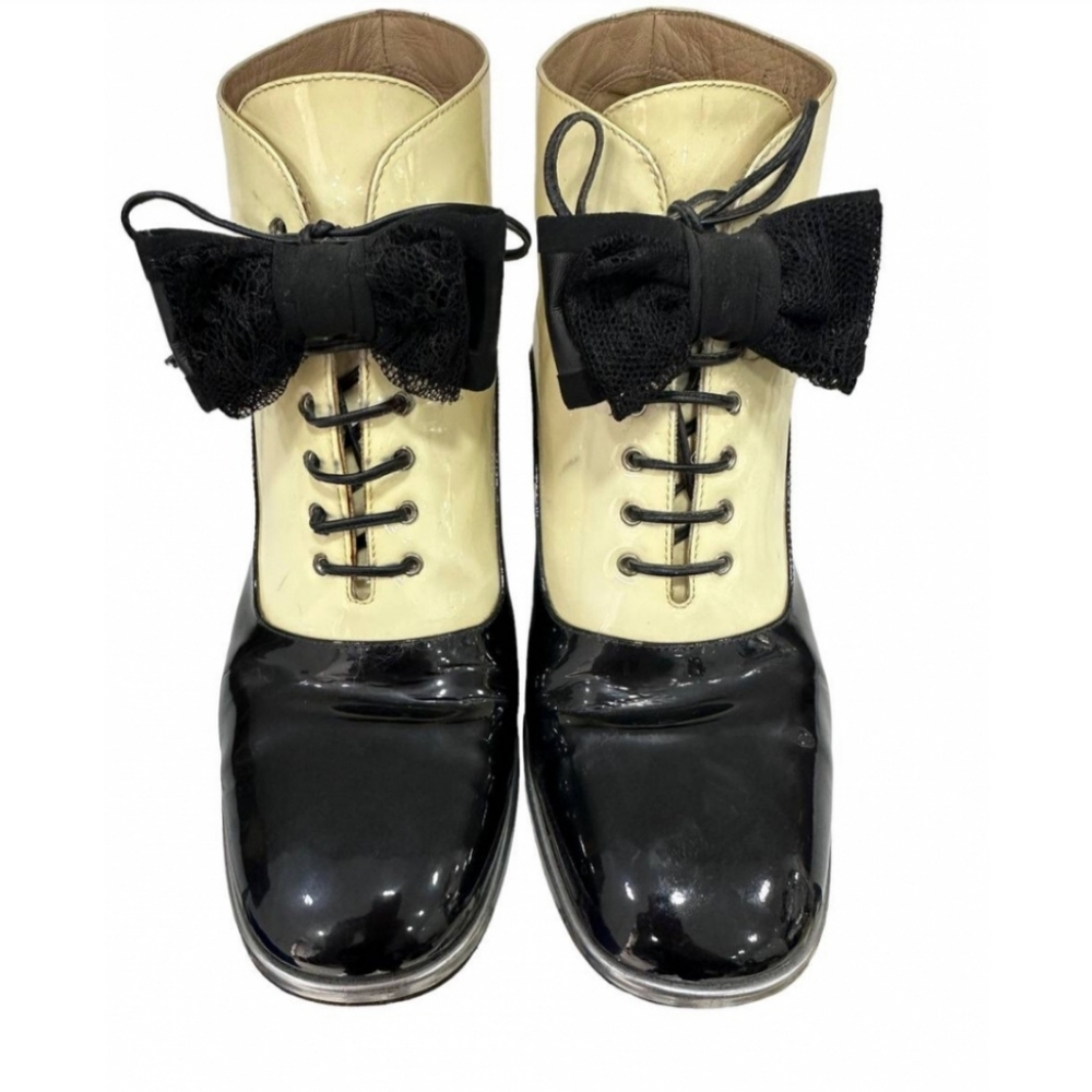 CHANEL patent leather lace up boots